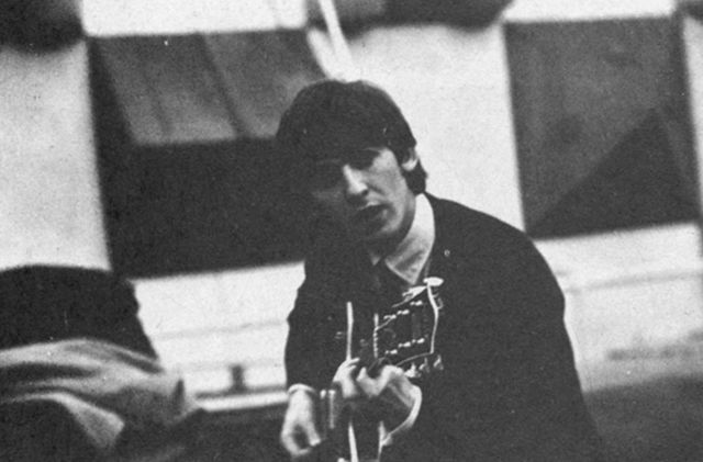 George Harrison studying the Spanish guitar.