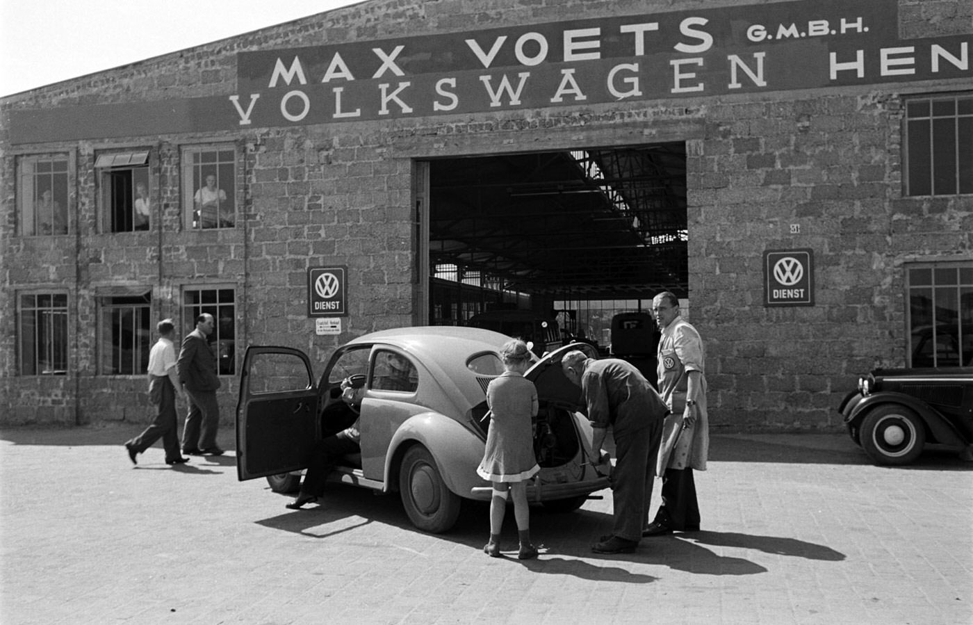 Inspecting a VW engine, 1951.