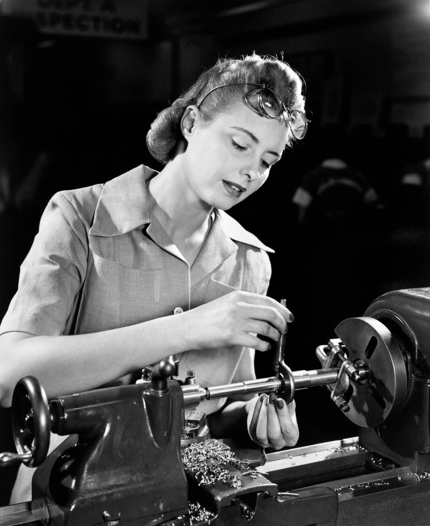 A woman working on a lathe, 1940s