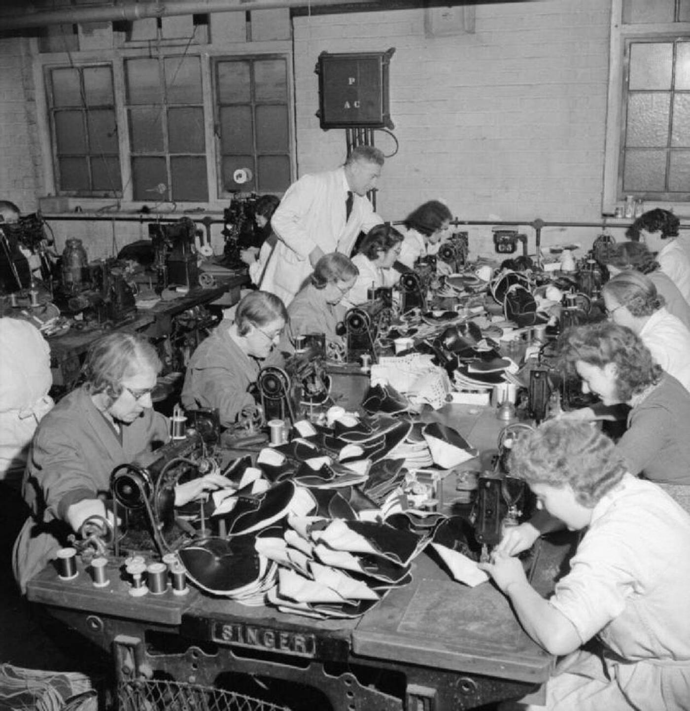 Machinists sewing shoe parts, World War II