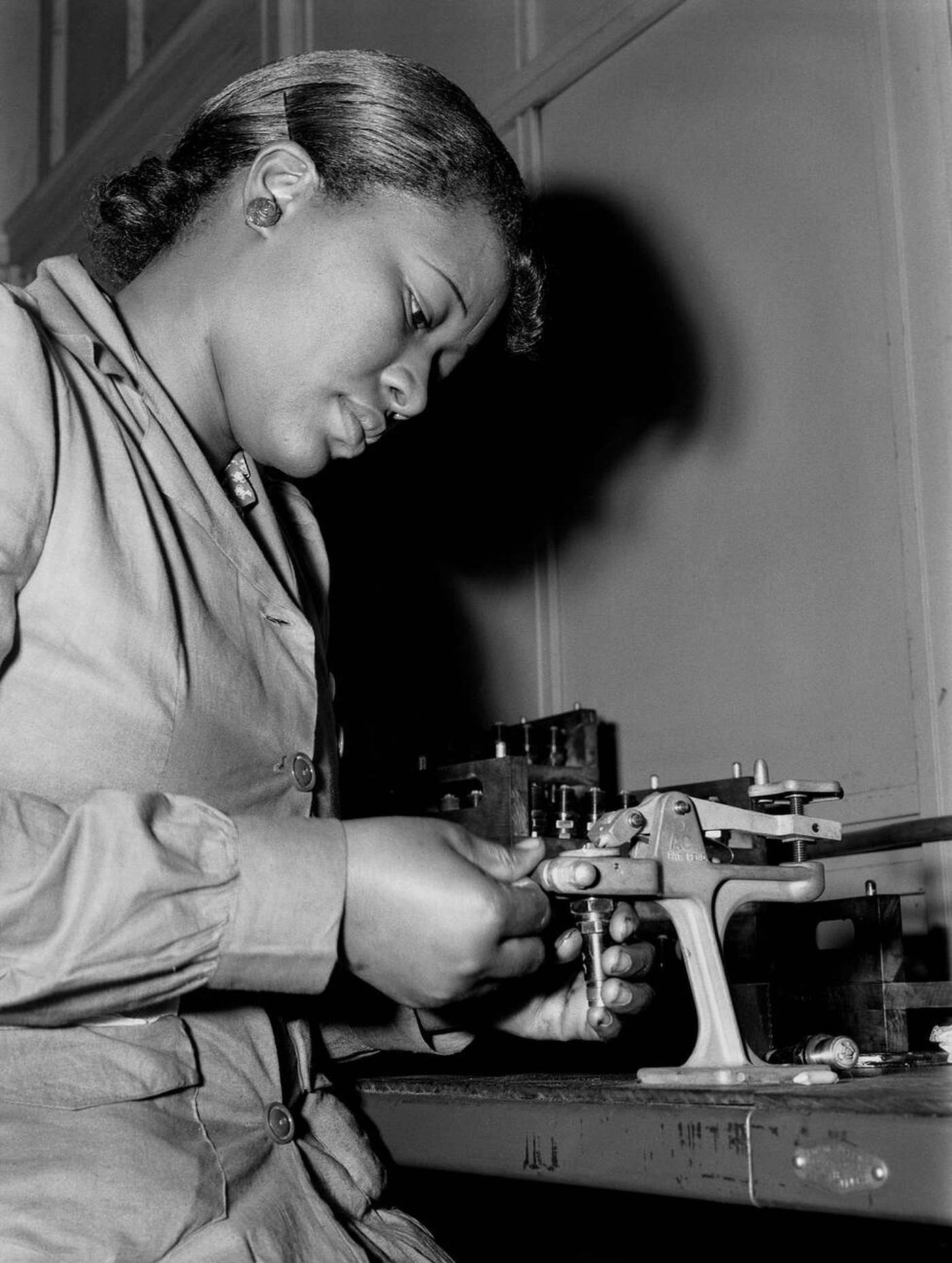 Mignon Gunn reconditioning spark plugs, 1942