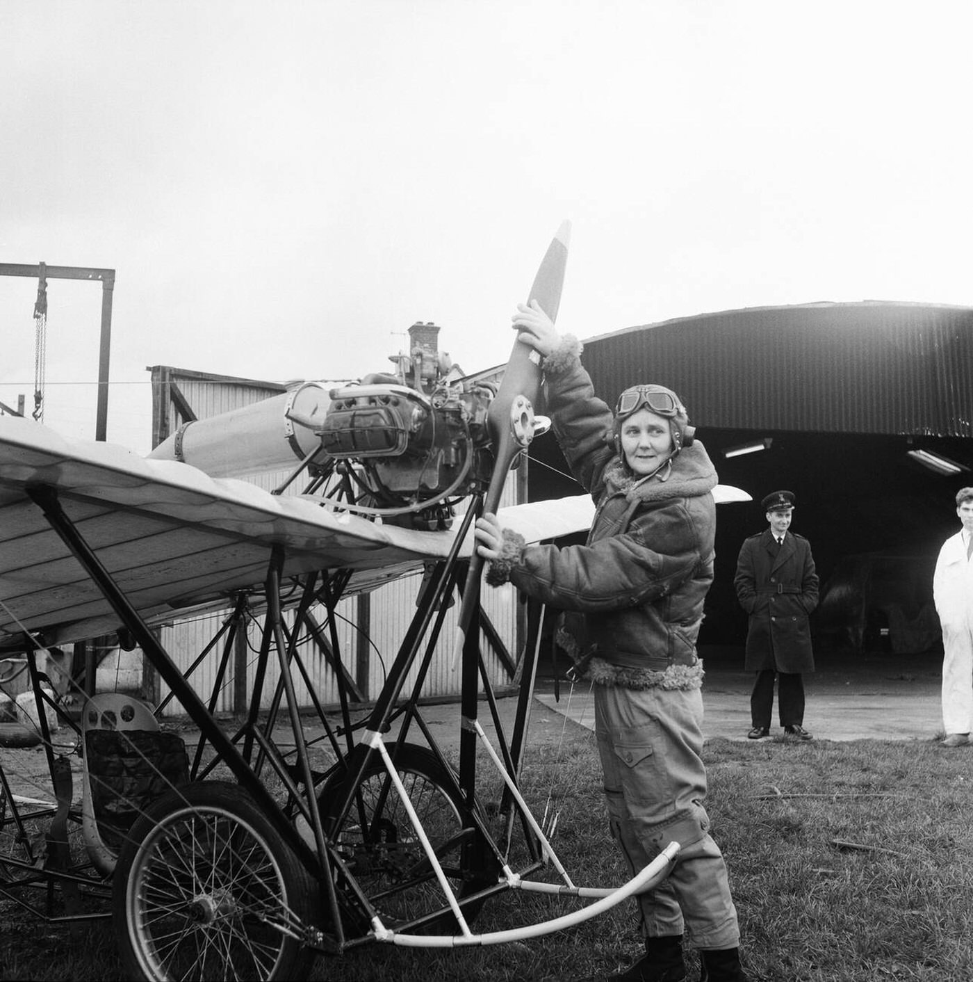 Joan Hughes testing a plane for a film, 1964