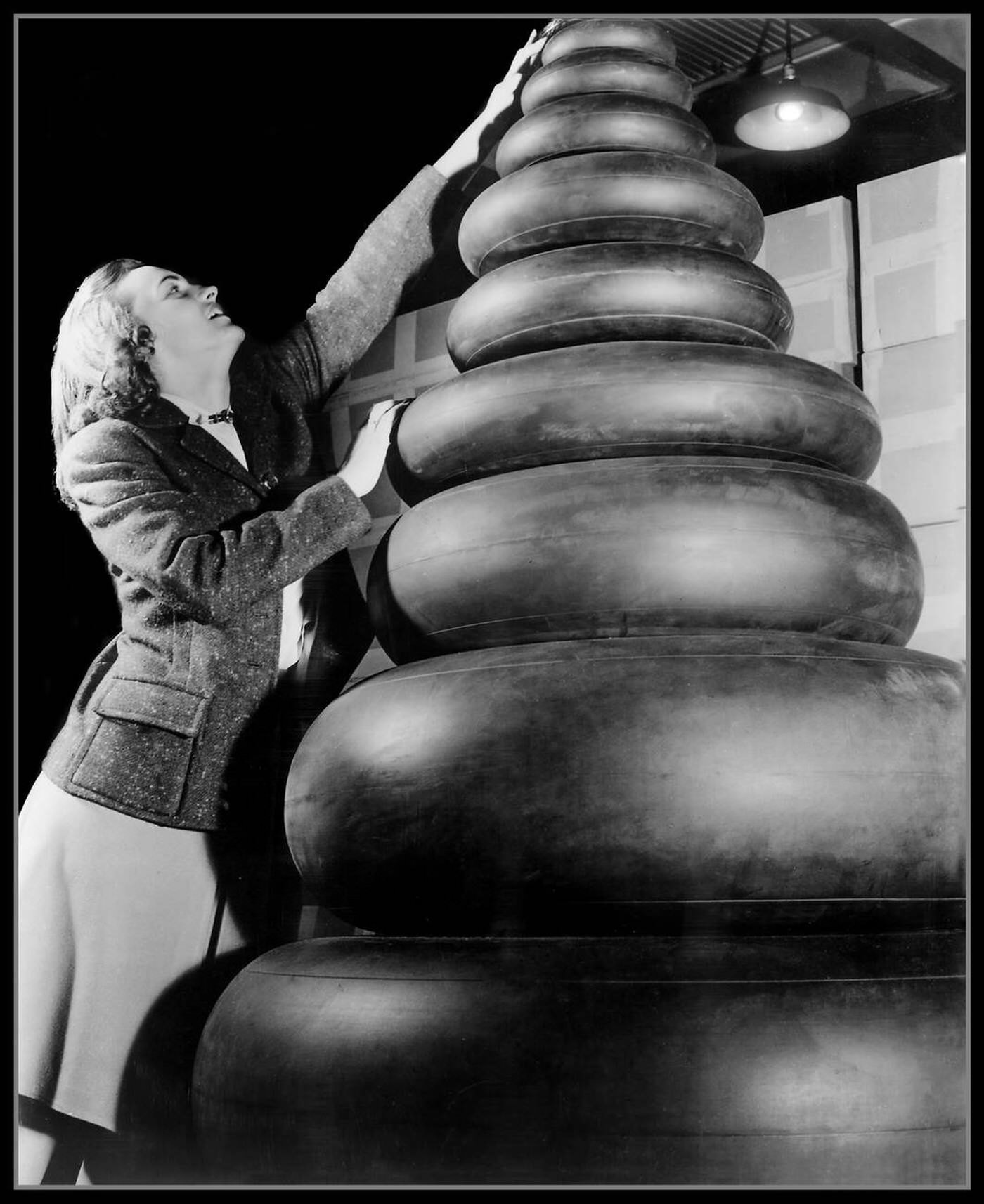 A woman checking aircraft tires, 1940s