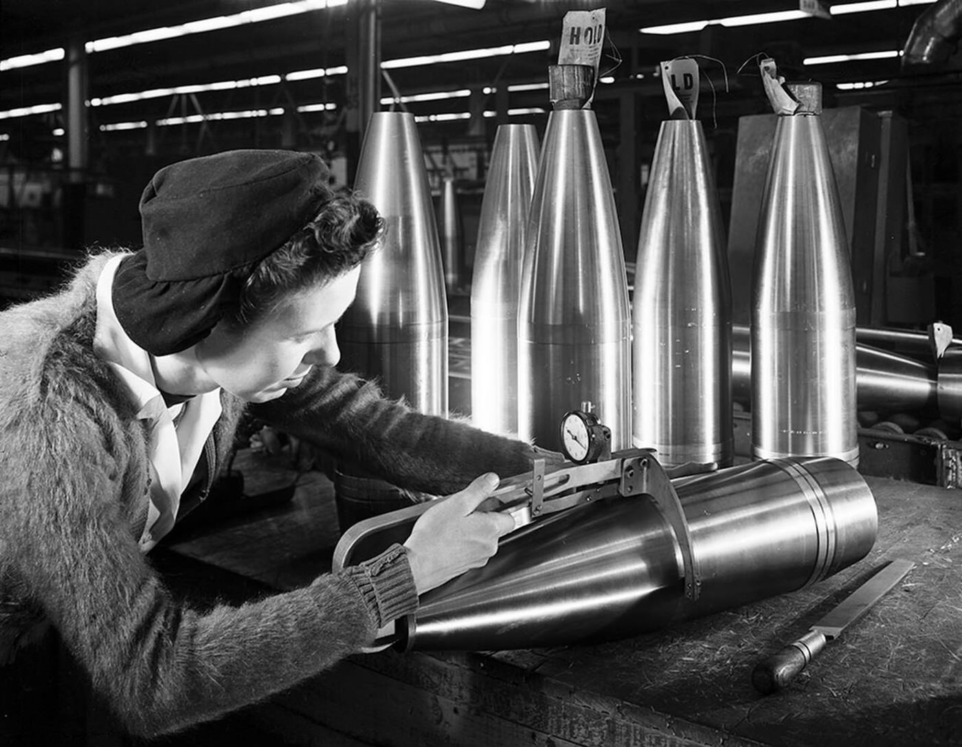 A woman working on ordnance at General Motors, World War II