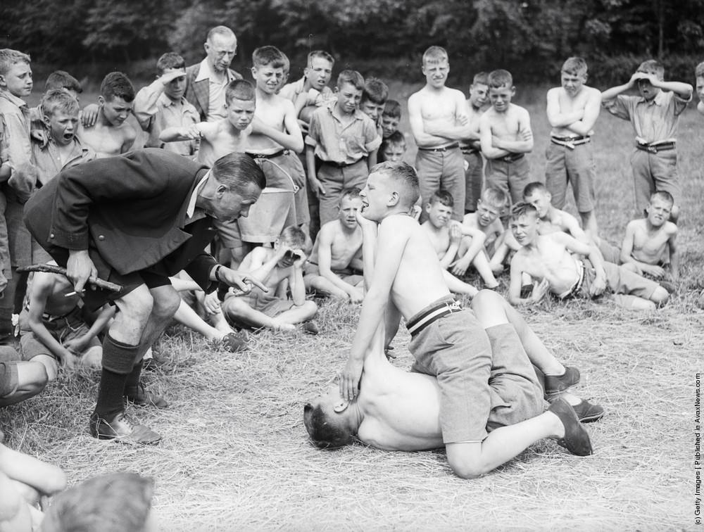 Friendly wrestling match at Ingham Old Hall summer camp, 1934