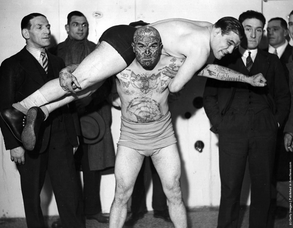 Jacobus Van Dyn, the “Tattoo Man,” trying out wrestling holds, 1930s