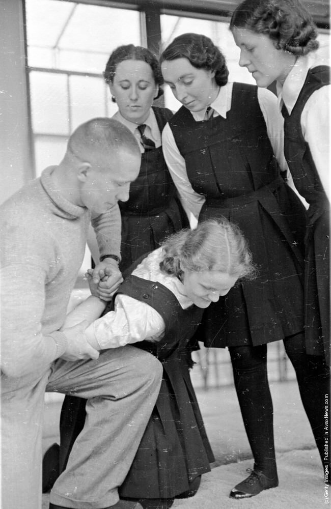Trainee policewomen watching ju-jitsu lessons, 1939