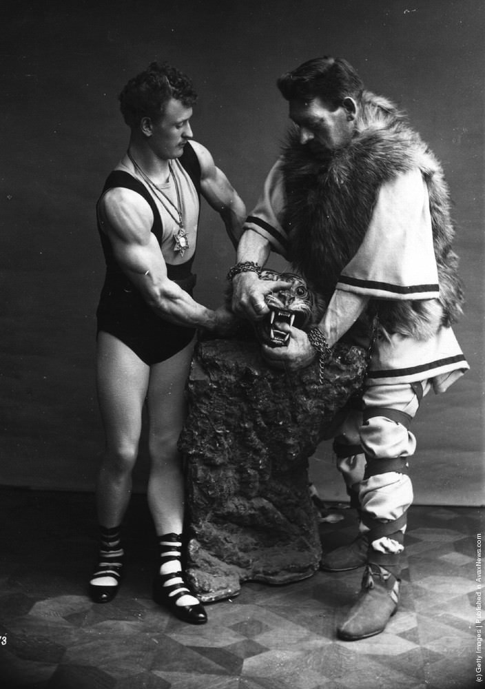 Strongmen Eugene Sandow and Goliath wrestling a bear, 1910