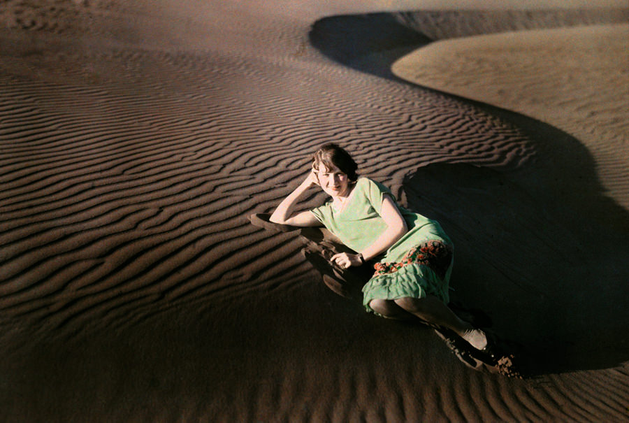 A woman poses in rippled sand dunes near Crescent City, California, June 1929.