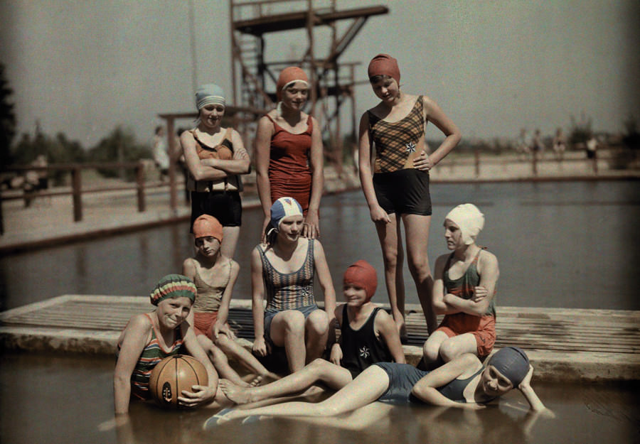Teenage girls in bathing suits and caps on a dock in Germany, March 1928.