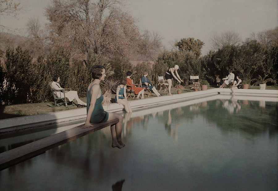 Women relax beside a swimming pool at a country estate near Phoenix, Arizona, 1928.