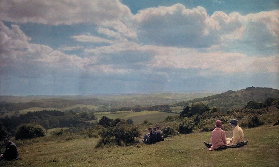 Locals enjoy the view of the Surrey Hills in England, 1928.
