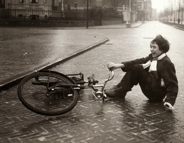 Girl fell off her bike on a slippery road in Haarlem, Netherlands, 1952.