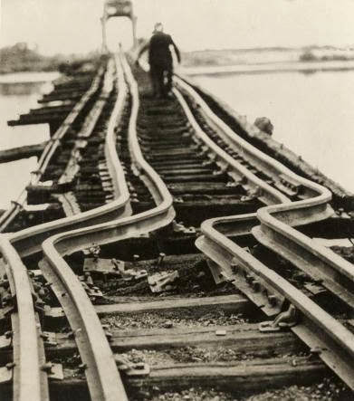 Bent rails on the railroad bridge over the Delaware River after a fire, 1935.