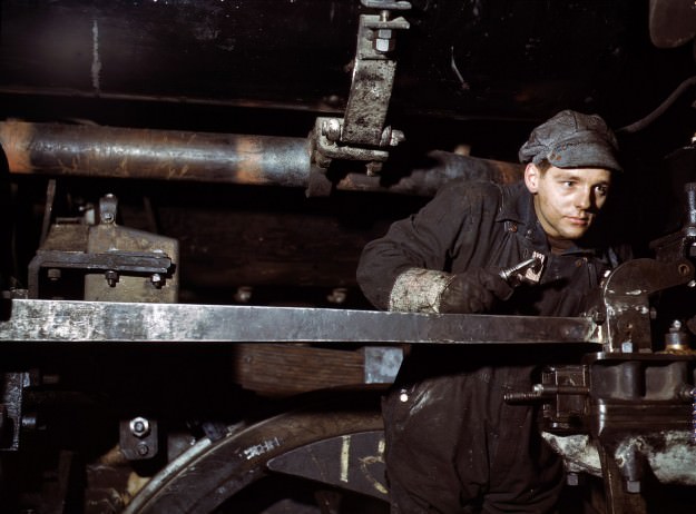 December 1942. A young worker at the Chicago & North Western 40th Street shops. 4×5 Kodachrome transparency by Jack Delano.