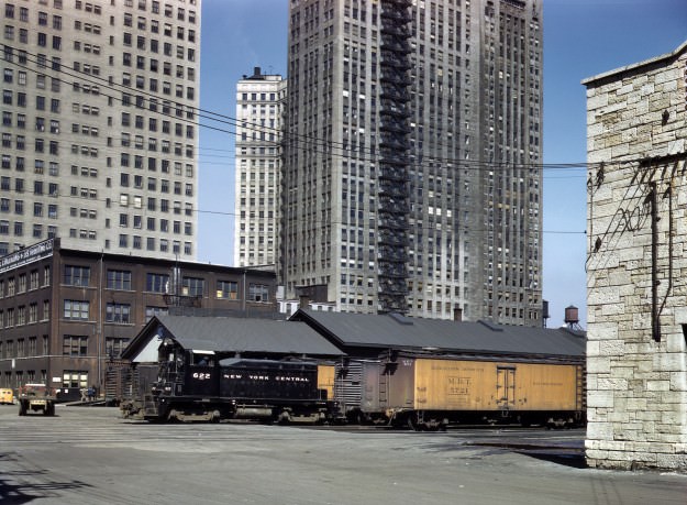 Chicago, April 1943. “New York Central diesel switch engine moving freight cars at the South Water Street terminal of the Illinois Central R.R.” 4×5 Kodachrome transparency by Jack Delano for the Office of War Information.