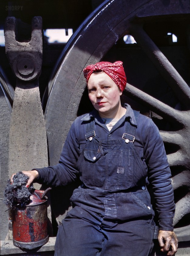 April 1943. Clinton, Iowa. “Mrs. Marcella Hart, mother of three, employed as a wiper at the roundhouse. Chicago & North Western R.R.” 4×5 Kodachrome transparency by Jack Delano for the Office of War Information.