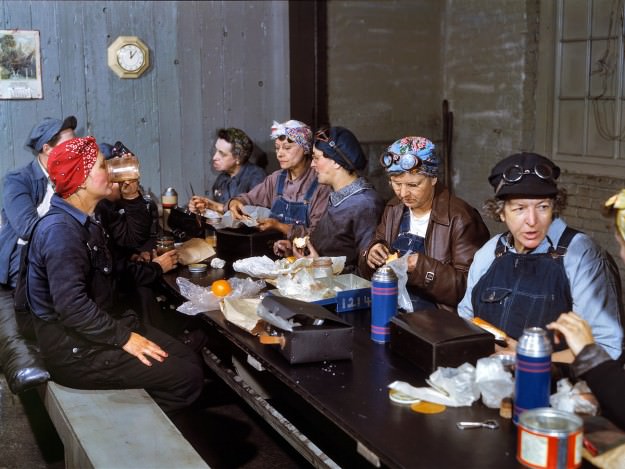 Women employed as roundhouse wipers having lunch, Chicago & North Western Railroad, Clinton, Iowa. Marcella Hart is at left, Mrs. Elibia Siematter at right. April 1943. 4×5 Kodachrome transparency by Jack Delano.
