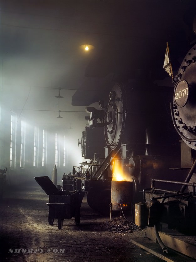 Roundhouse at the Chicago and Northwestern Railroad yard, Chicago. December 1942. 4×5 Kodachrome transparency by Jack Delano.