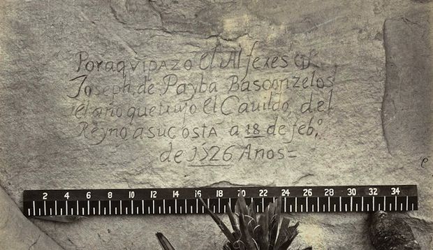 A close-up view of a Spanish inscription carved into the sandstone at Inscription Rock in New Mexico in 1726. Translation: “By this place passed Ensign Don Joseph de Payba Basconzelos, in the year in which he held the Council of the Kingdom at his expense, on the 18th of February, in the year 1726.”