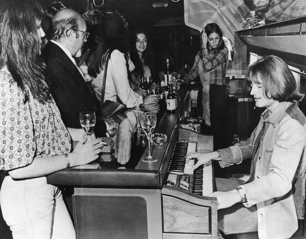 John Paul Jones of Led Zeppelin playing an organ on board their Boeing 720B "The Starship", 1973.