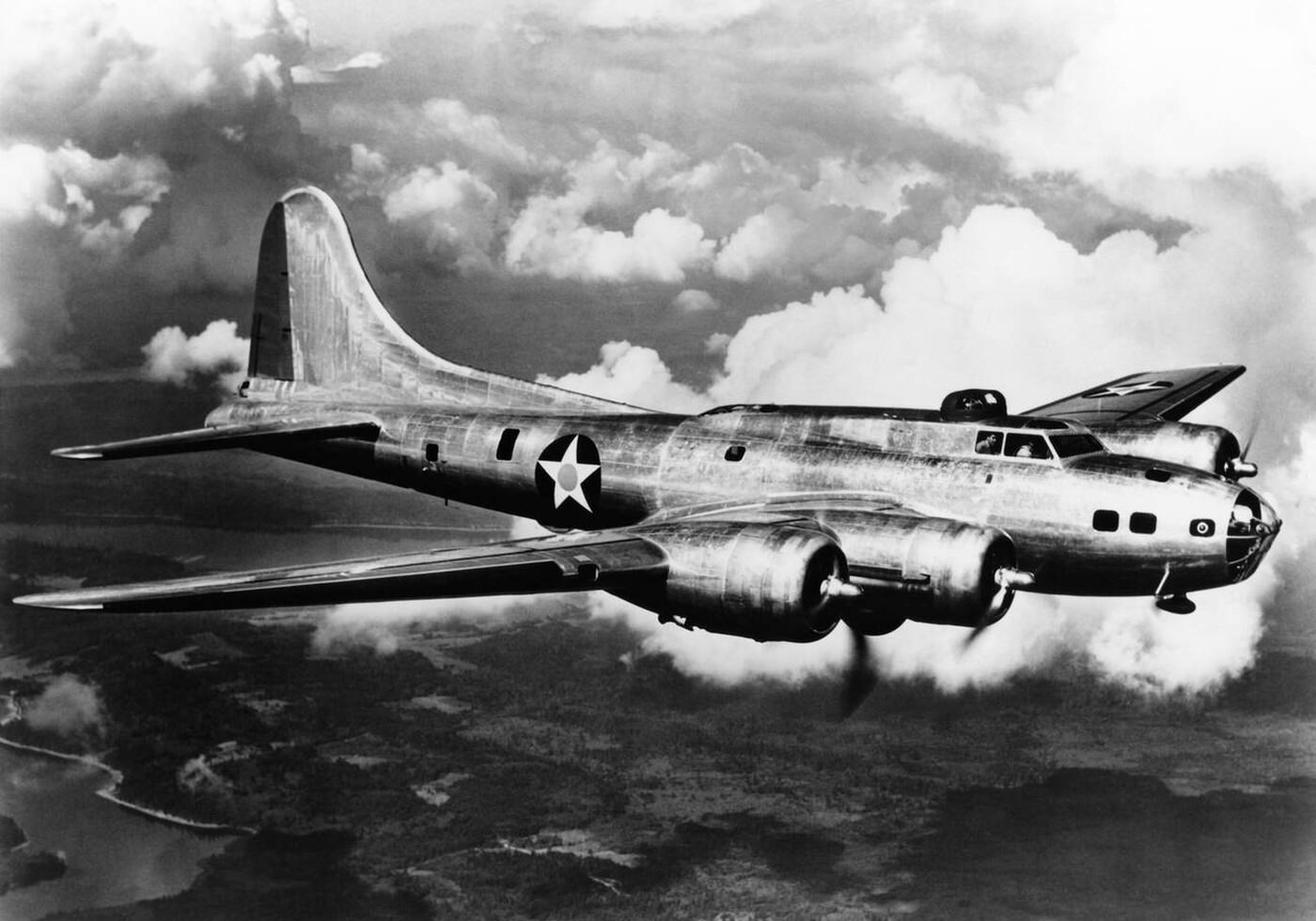 A Boeing B-17E bomber flying through clouds, 1940s.