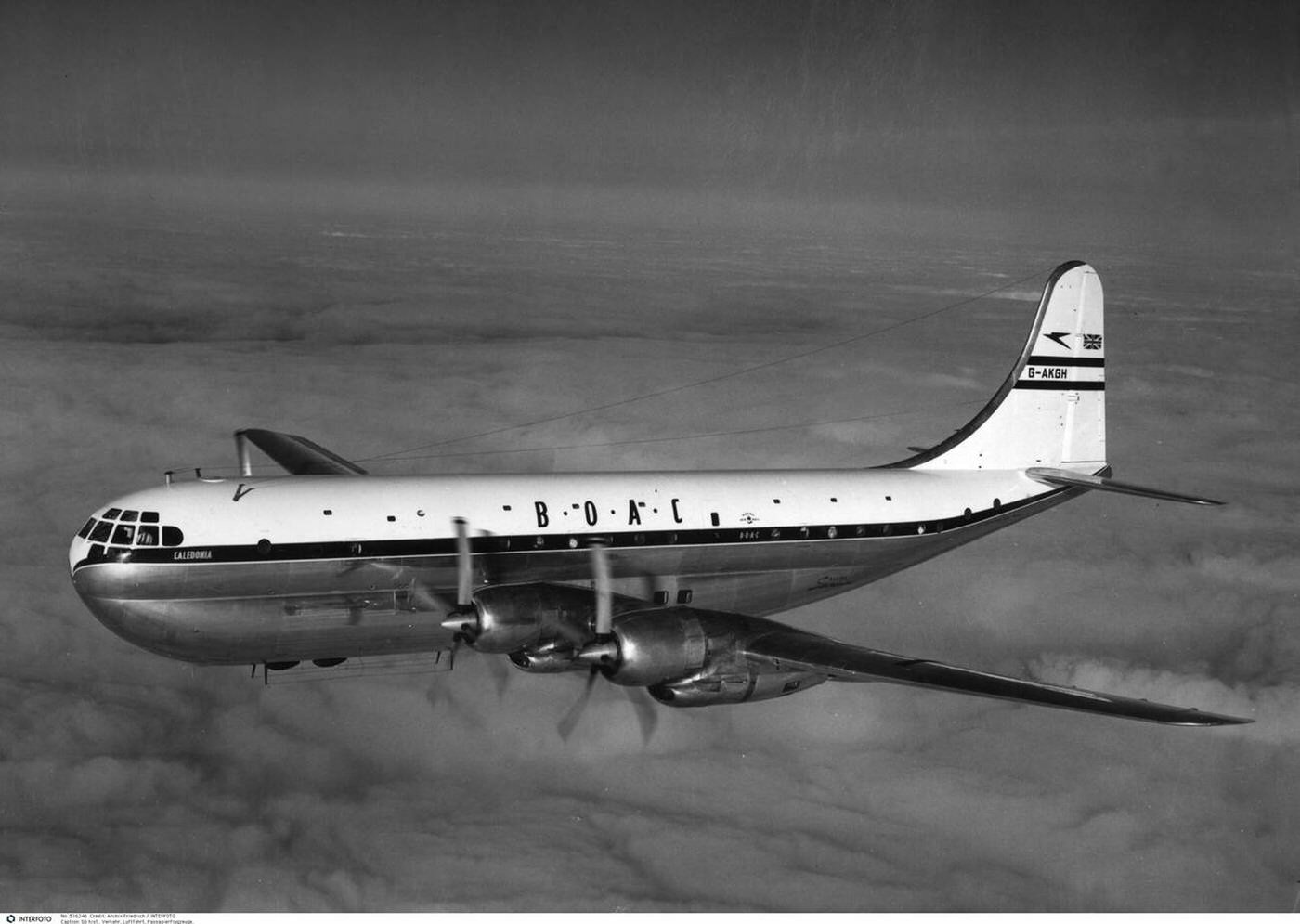 A BOAC Boeing 377 "Stratocruiser" flying over clouds, 1940s.