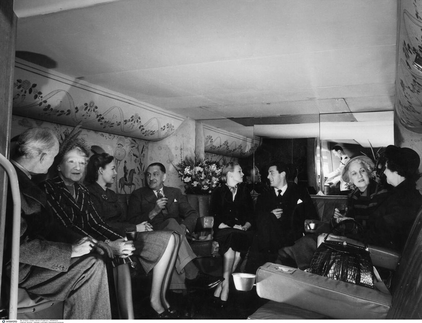 Passengers at the bar on the lower deck of a BOAC Boeing 377 "Stratocruiser", 1940s.
