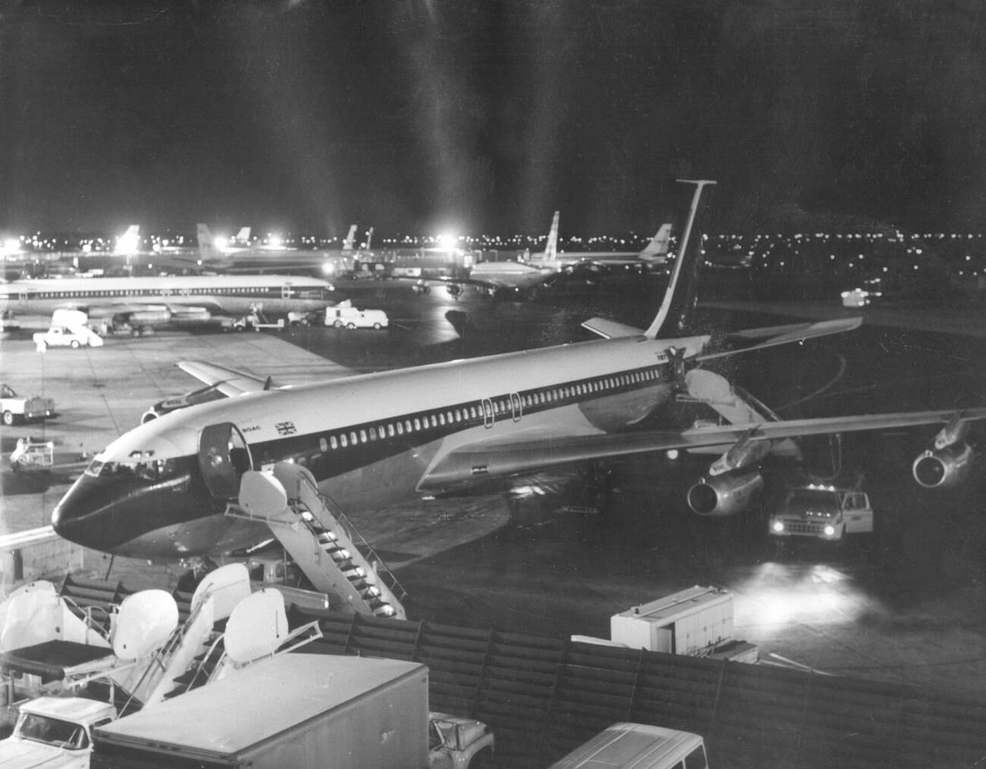 A Boeing 707 at night,