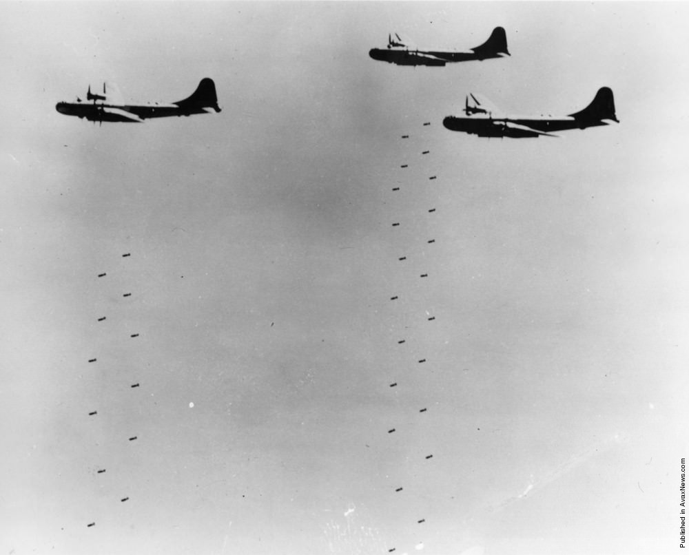 Three Boeing B-29 Superfortress bombers dropping bombs over North Korea, 1952.