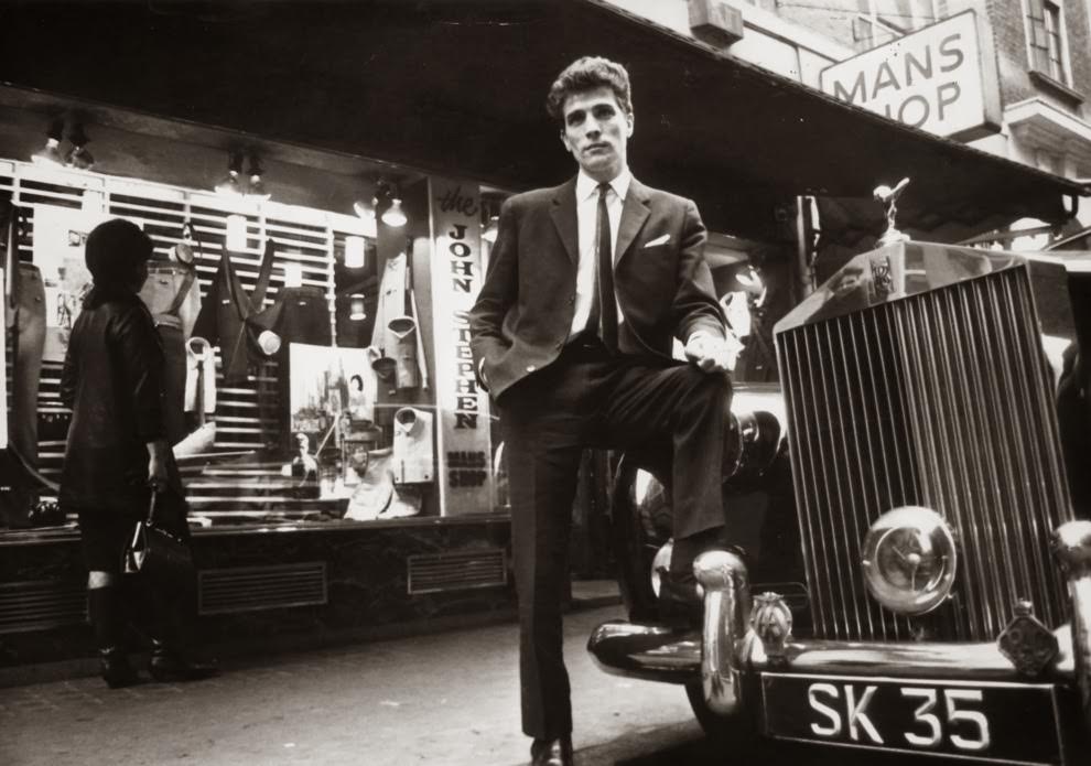 February 1964: Tailor John Stephen, with his Rolls Royce outside his shop.