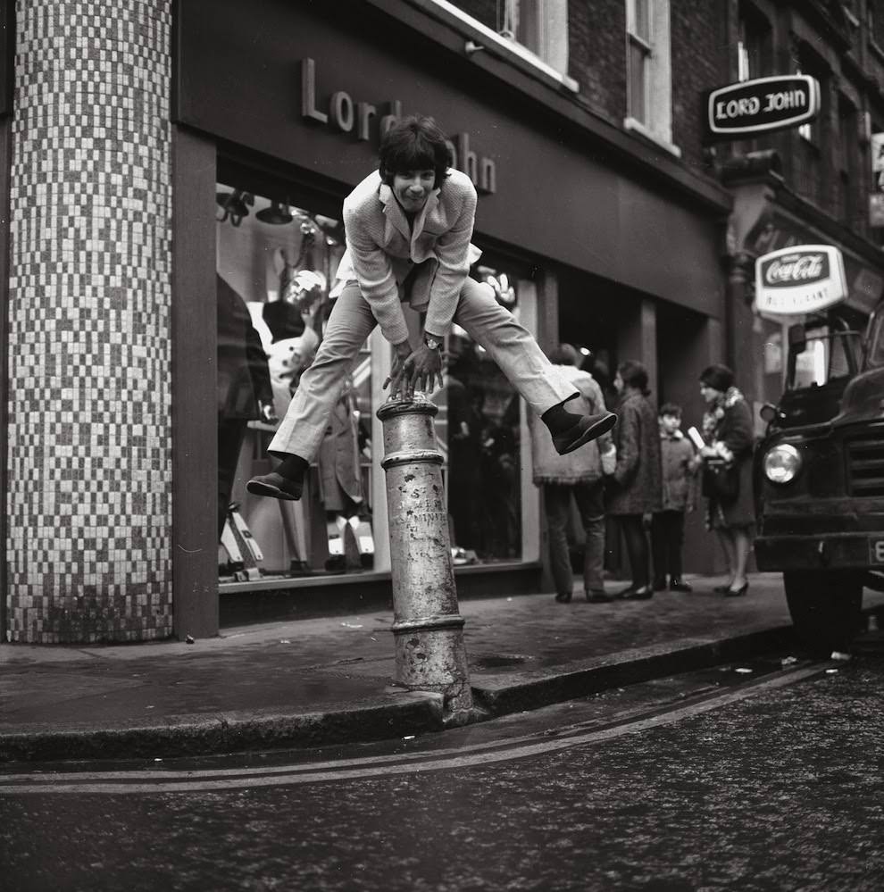 24th January 1967: Cat Stevens (later Yusuf Islam) leaps a bollard.