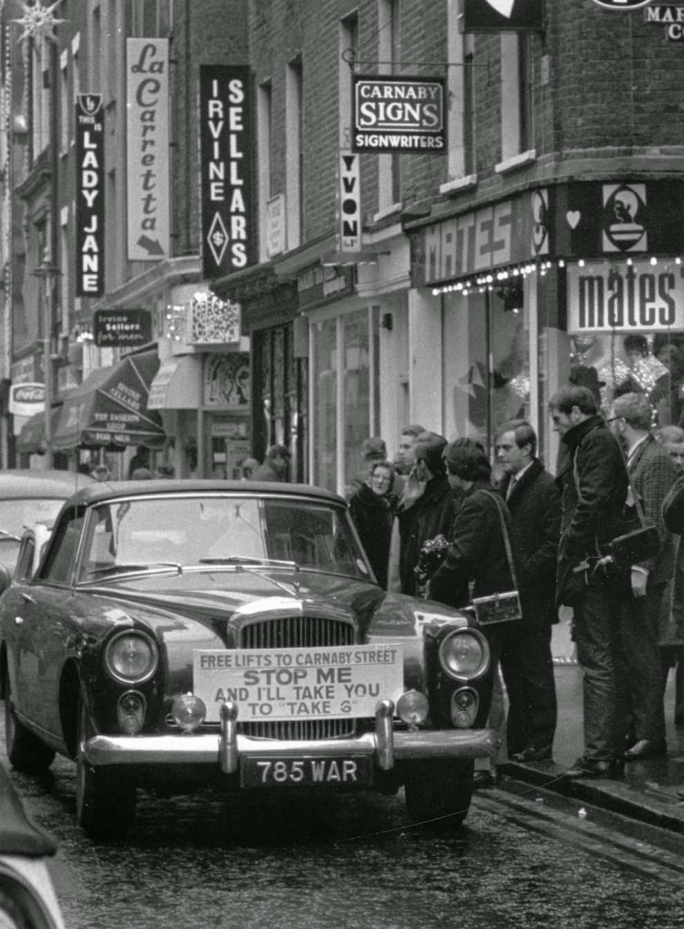 12 December 1967: A taxi offering free rides to Carnaby Street.