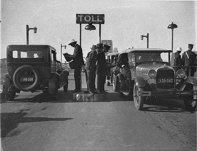 The first cars at the toll bar during the opening of the Sydney Harbour Bridge, 1932.