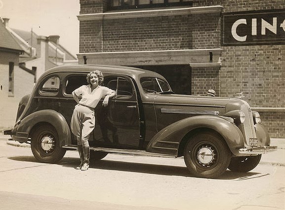 Film actor Helen Twelvetrees and her 1935 Pontiac, Cinesound Studios, Sydney, 1936.