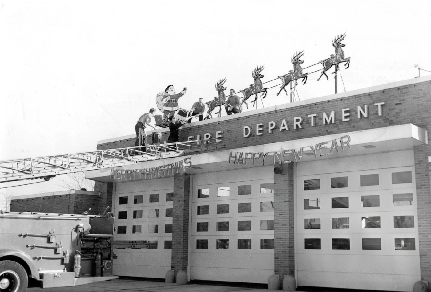 Firemen decorate their station with Santa Claus and his reindeer in the Dorchester neighborhood of Boston, 1959.
