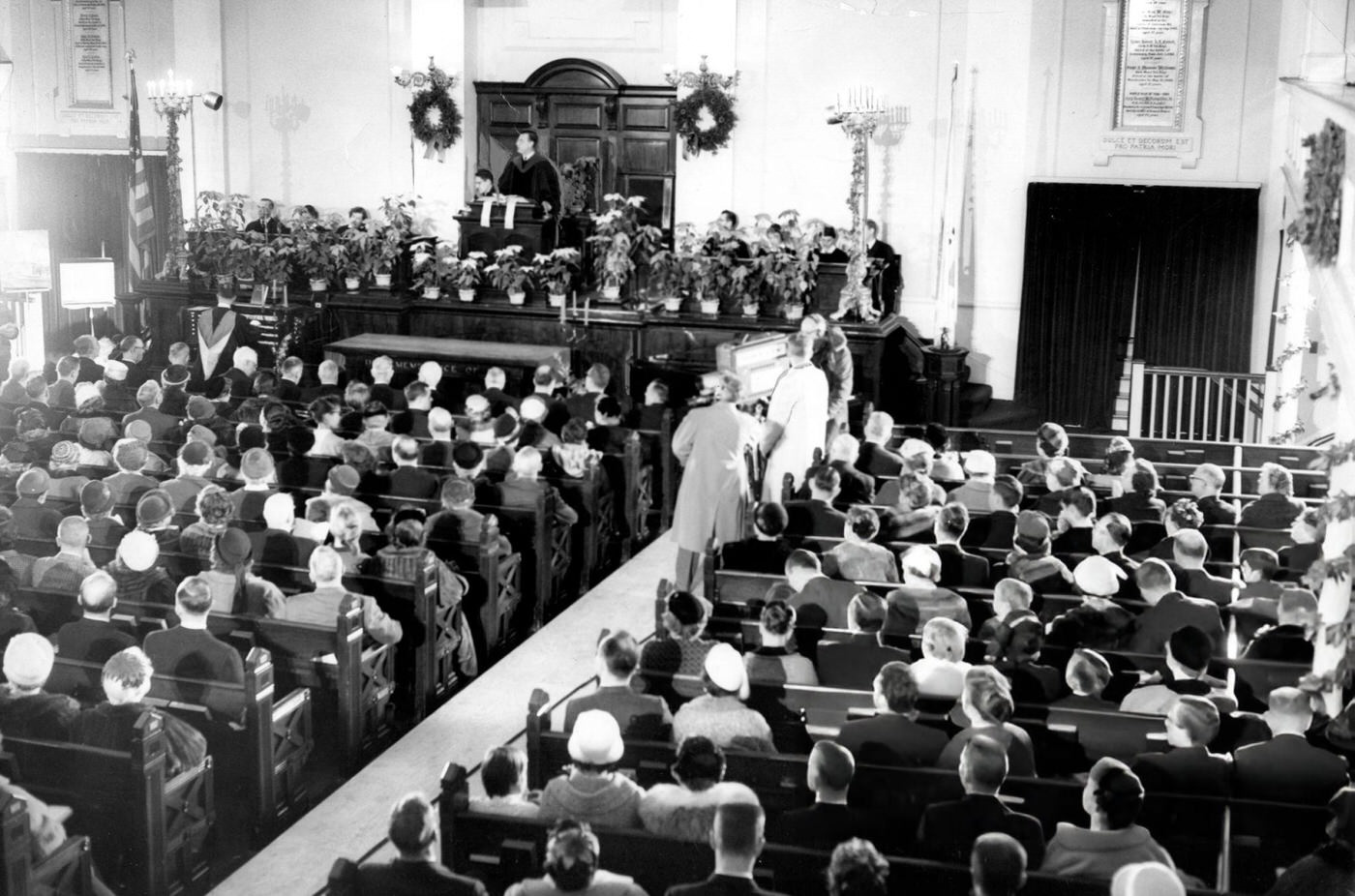 TV cameramen record Rev. Dr. Harold John Ockenga speaking inside Park Street Church in Boston, 1959.