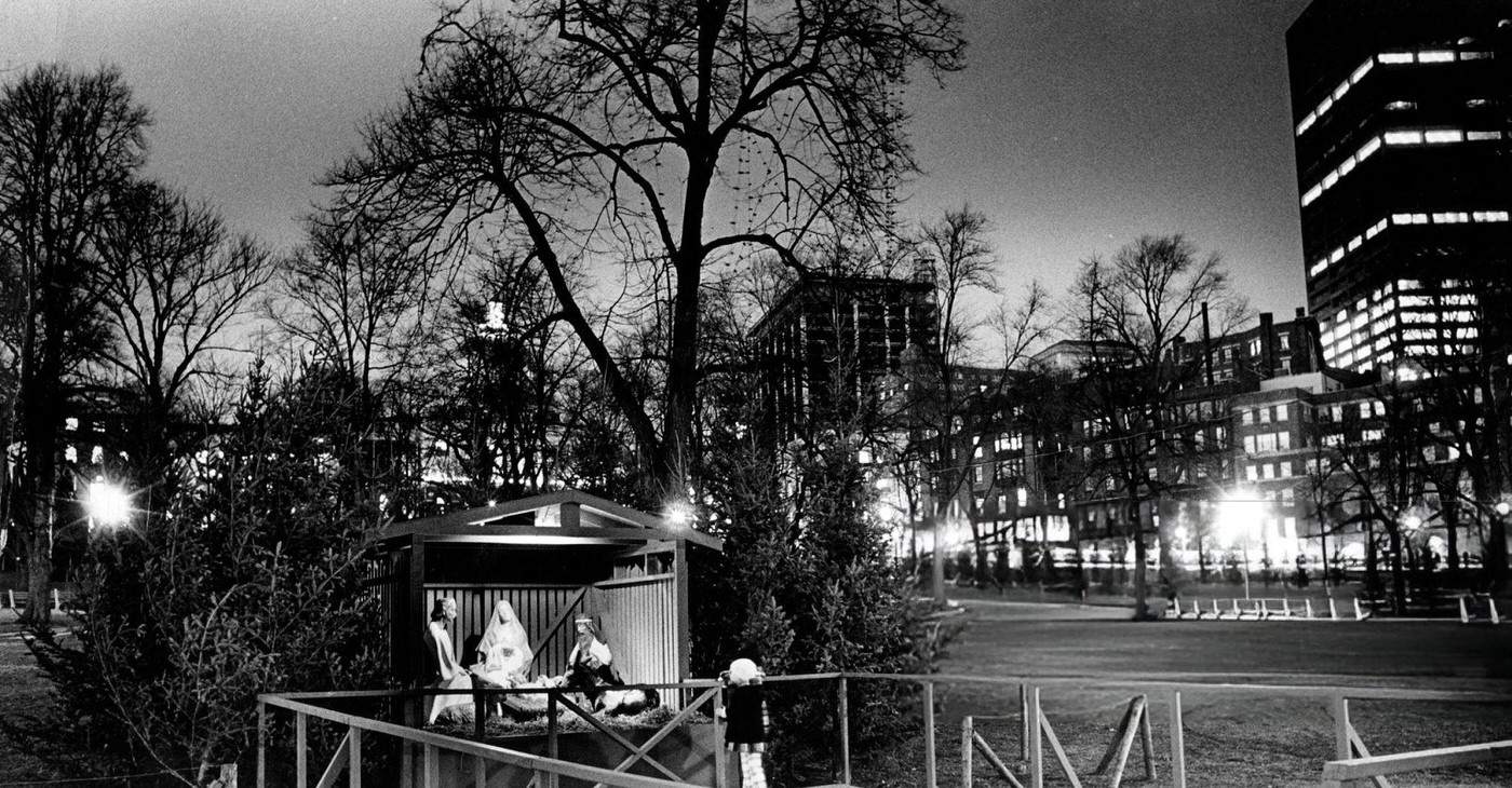 A young girl looks at the nativity scene on Boston Common before the lighting of the Christmas lights, 1973.