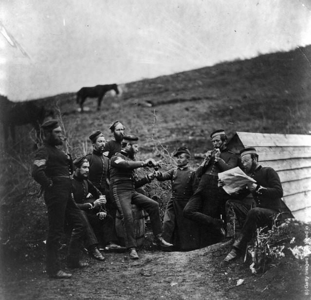 English and French soldiers sharing a drink in the trenches before Sebastopol during the Crimean War, 1850s.