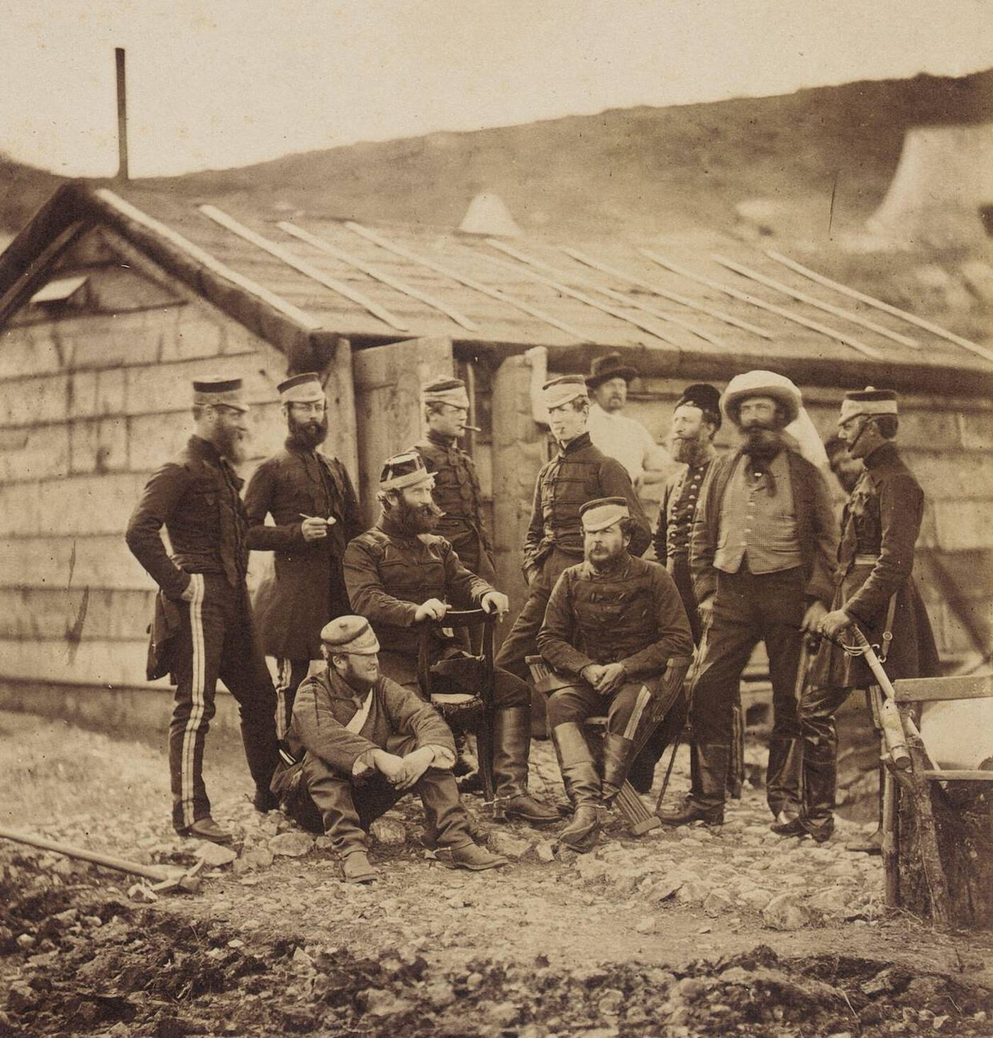 Officers of the 4th Light Dragoons relaxing by a building during the Crimean War, 1855.