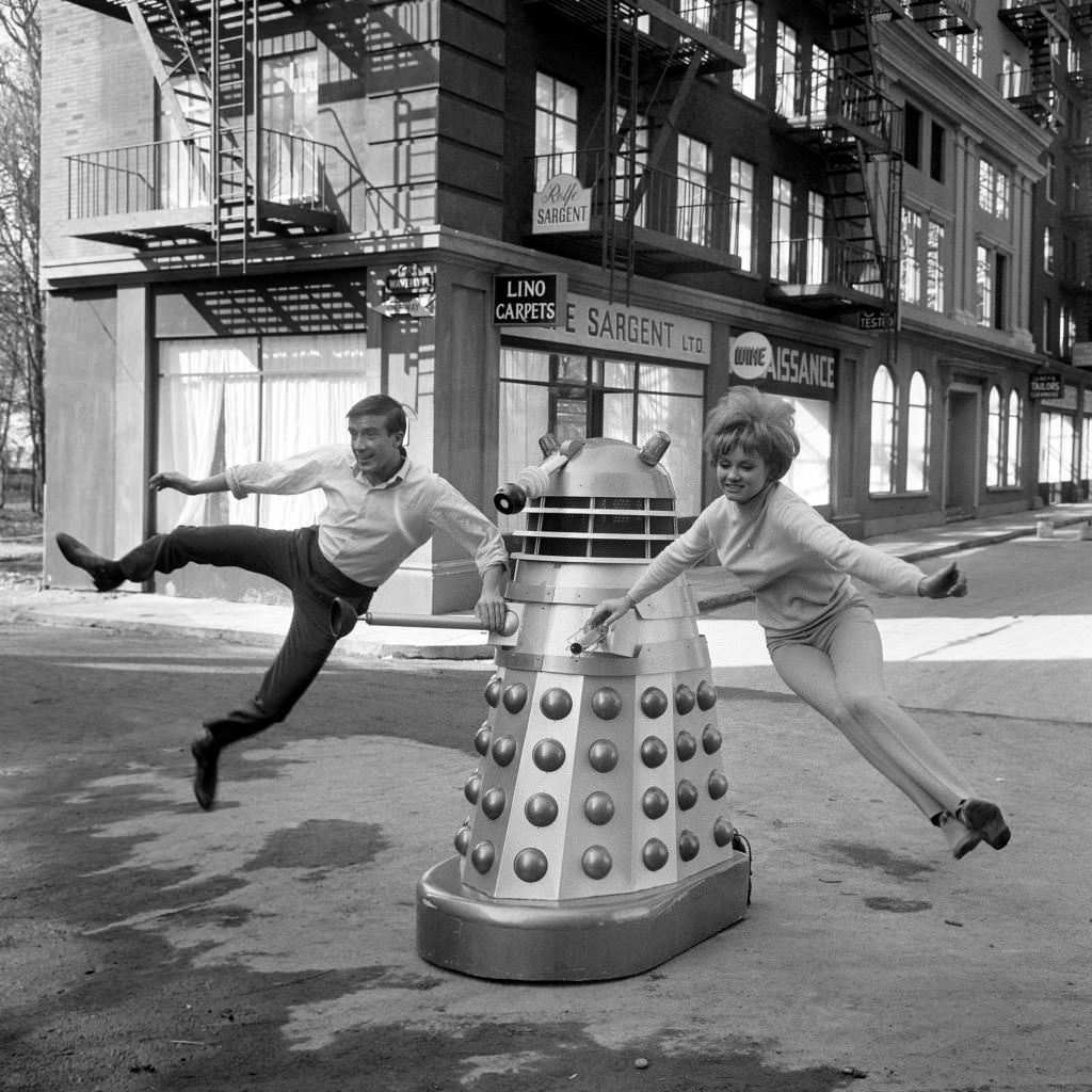 Roy Castle and Jennie Linden dance with a Dalek at Shepperton Studios for “Dr Who and the Daleks”, 1965.