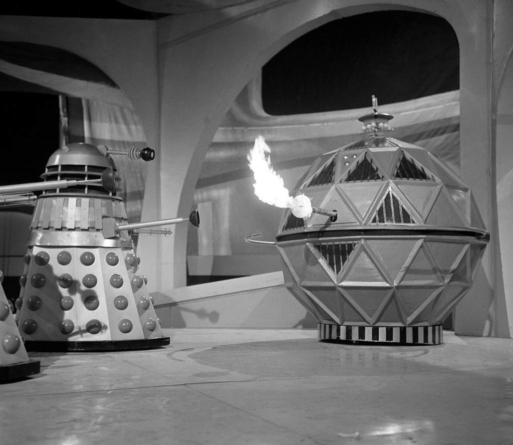 A Dalek confronting a flame-belching Mechanoid at Ealing Studios, London, 1965.