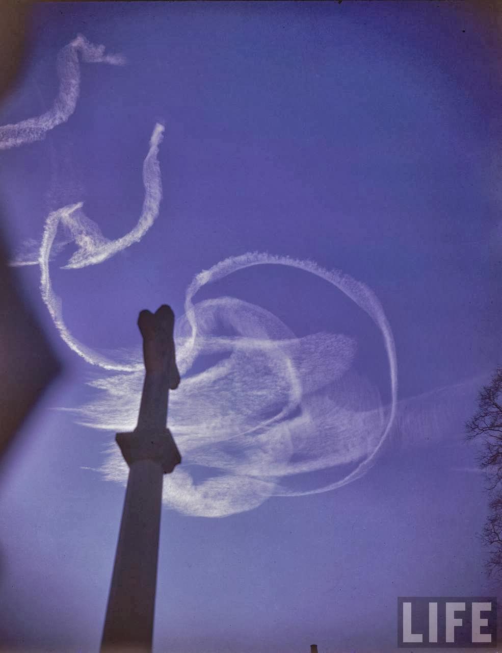 Vapor trails from RAF planes in the skies over England recall the convolutions of British & German pilots fighting air duels throughout the summer of 1940 during the Battle of Britain.