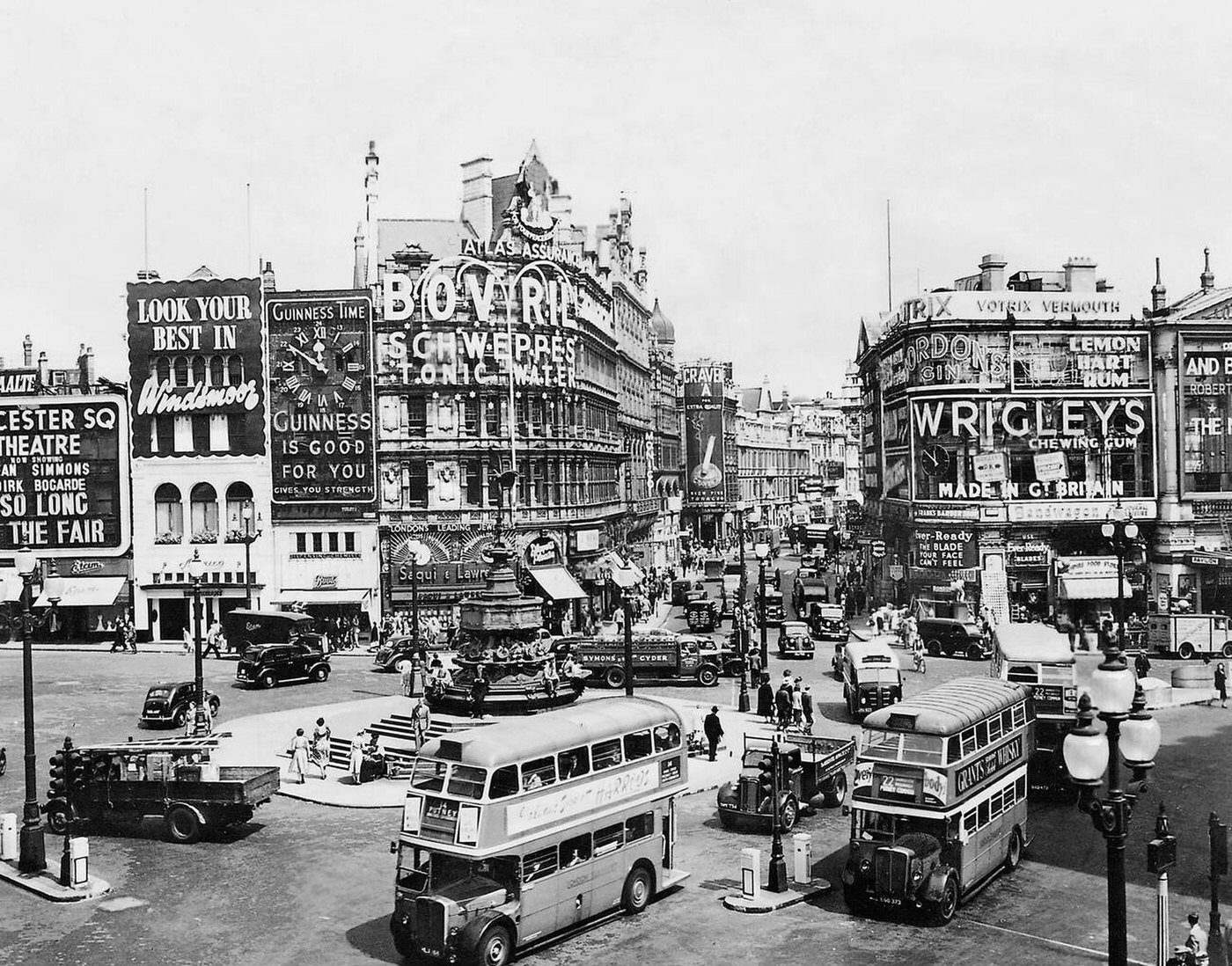Piccadilly Circus, the busiest square in London, with the Eros statue fountain in the middle, 1920s.
