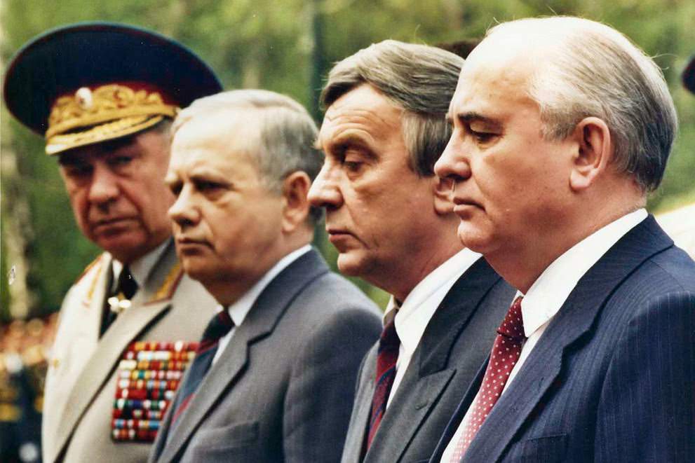 Mikhail Gorbachev surrounded by future leaders of the August Coup outside the Kremlin wall, 1991.