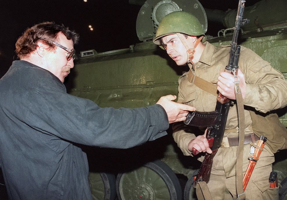A pro-democracy demonstrator argues with a Soviet soldier in Moscow, 1991.