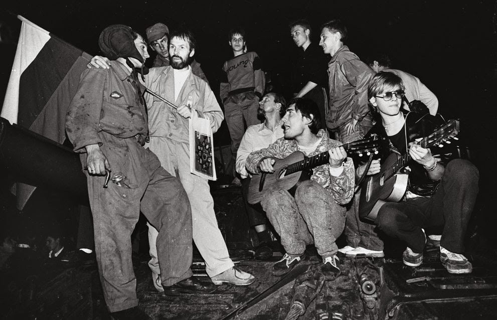 Residents play music and talk to soldiers in front of the Russian White House in Moscow, 1991.