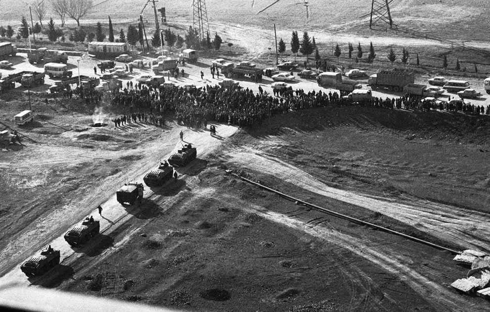 A crowd blocks Soviet tanks on a road near Ganja, Azerbaijan, 1990.