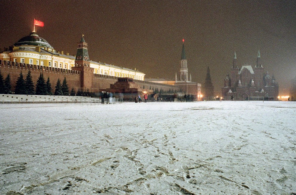 The Soviet flag flies over the Kremlin at Red Square in Moscow, 1991.
