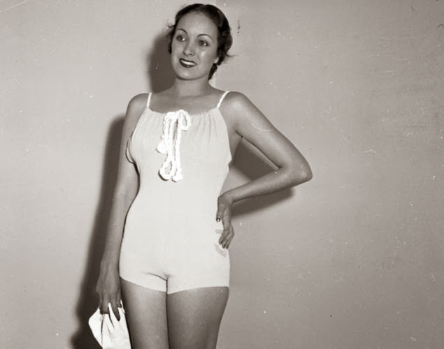 Bathing suits were definitely more conservative back in 1935! Here, model Priscilla Lawson stands pretty in a rubber swimsuit.